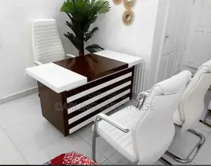 Modern Executive Office Table Features a Contrasting Brown and White