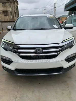 Honda Pilot Touring 4dr SUV 4WD (3.5L 6cyl 9A) 2017 White