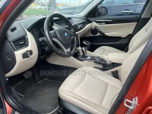 BMW X1 xDrive28i 4dr SUV AWD (2.0L 4cyl Turbo 8A) 2014 Orange