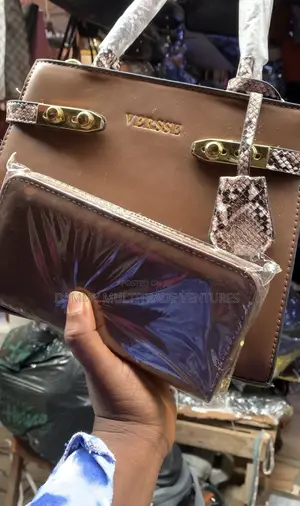 Versse Handbag Features a Brown Leather Exterior