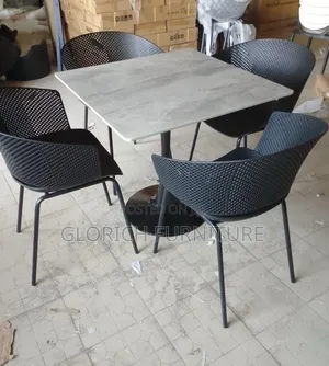 4-Seater Marble-Top Dining Set – Perforated Armchairs Pedestal Base