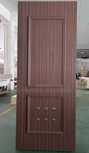 Walnut-Finished Wood Plastic Composite Door With a Molded Panel Design