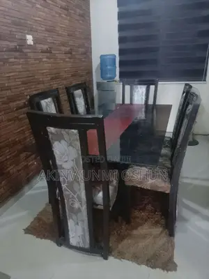 Dining Table With Glass Top and Six Chairs