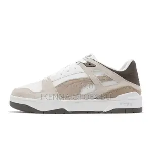 White and Brown Puma Slipstream