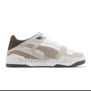 White and Brown Puma Slipstream