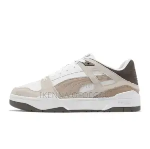 White and Brown Puma Slipstream