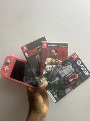 Nintendo Switch Lite With Fc 26, 25, Red Dead Redemption