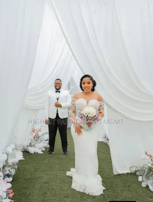 Off-Shoulder Sweetheart Mermaid Bridal Gown With Tiered Ruffle Hem