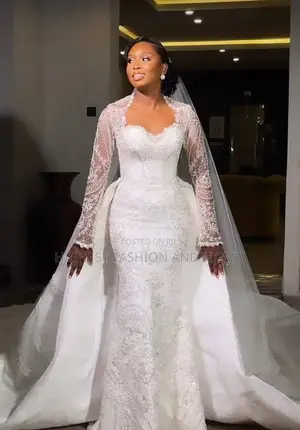 Long-Sleeve Patterned Lace Bridal Dress and Detachable Cathedral Train