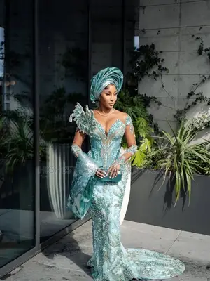 Encrusted Mint Green Lace Snatched Gown With Matching Structured Gele