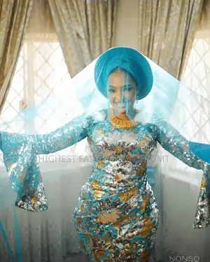 Elite Flared-Sleeve Turquoise Sequin Bridal Gown With Matching Gele