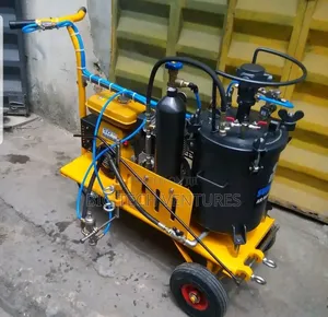 Yellow and Black Industrial Machine Is a Hand-Push Road Marking Machin