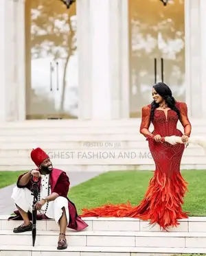 Luxury Coral Beaded Igbo Bridal Gown With Feathers
