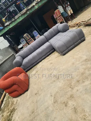 Grey Upholstery Padded L-Shaped Sofa Couch.