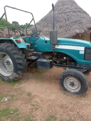 Performer Model 2010 Farm Tractor With Trailer Disc Harrow