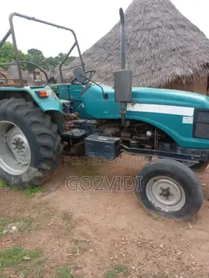 Performer Model 2010 Farm Tractor With Trailer Disc Harrow