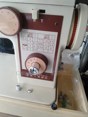 Original Electric and Manual Straight and Zigzag Sewing Machine.