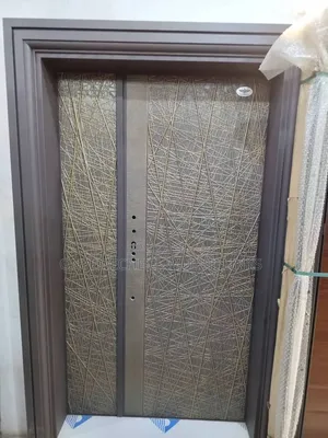 Metal Security Door With Prominent Gold-Colored With String Design