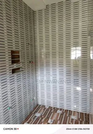 Wall Tile Installation. My People Guess the Size