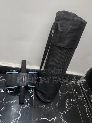 Yoga Mat and Flat Tommy Rolling Ball