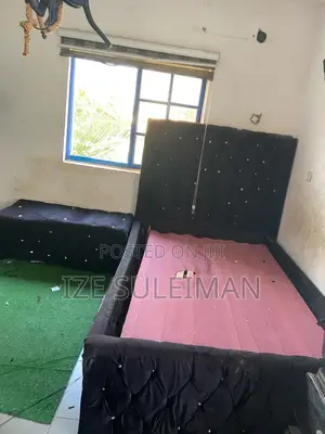 Bed Frame With a Side Chiar
