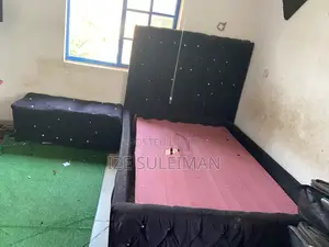 Bed Frame With a Side Chiar