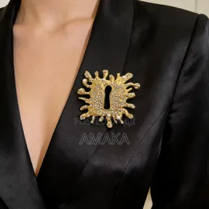 Schiaparelli Gold Studded Keyhole Brooch