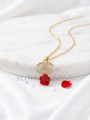 Gold Necklace With Red Flowery Pendant