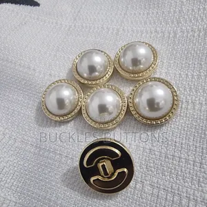 White and Gold Metal Button