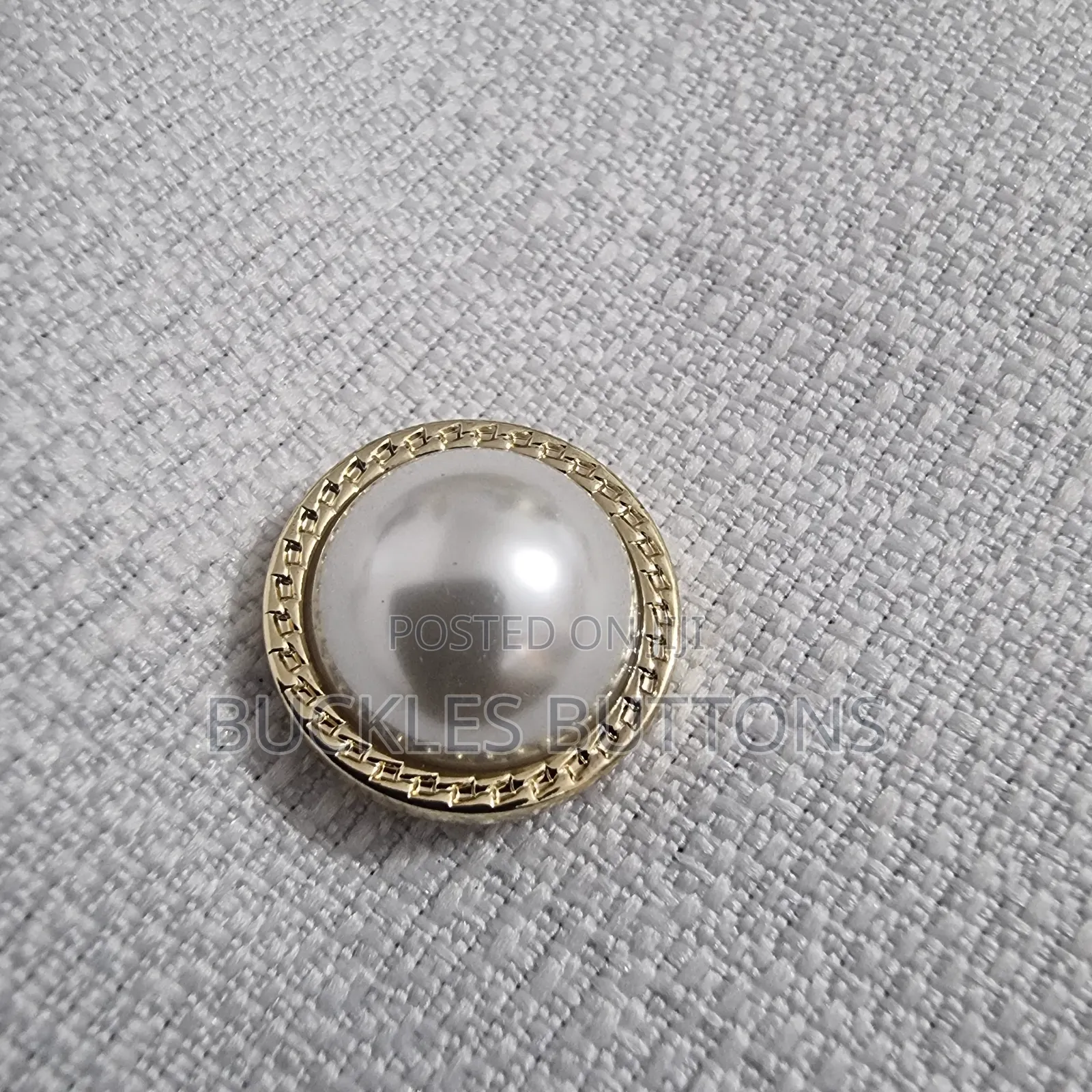 White and Gold Metal Button