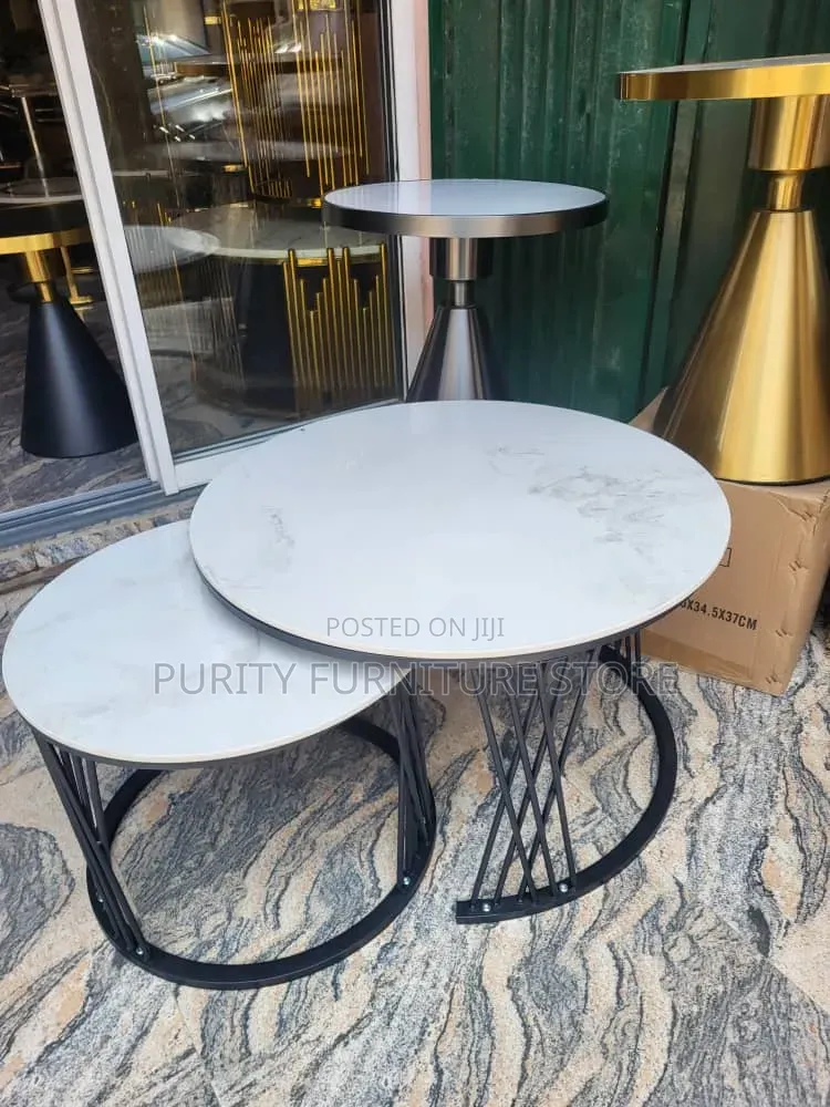 This Generic High-Quality Nested Table Set Features White Faux Marbles
