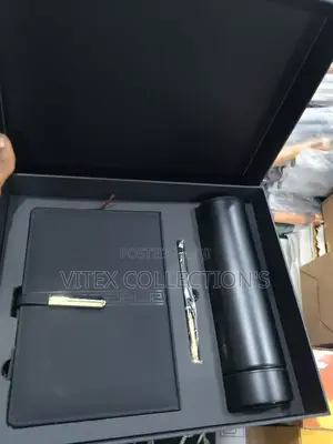 Notebook With Flask And Pen