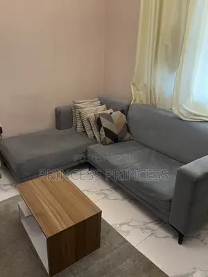 L-Shaped Sofa With Throw Pillows