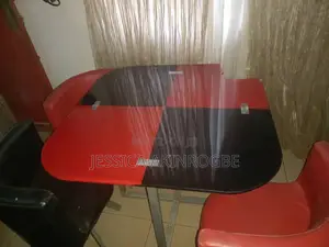 An Oval.Glass Black and Red Dinning Set