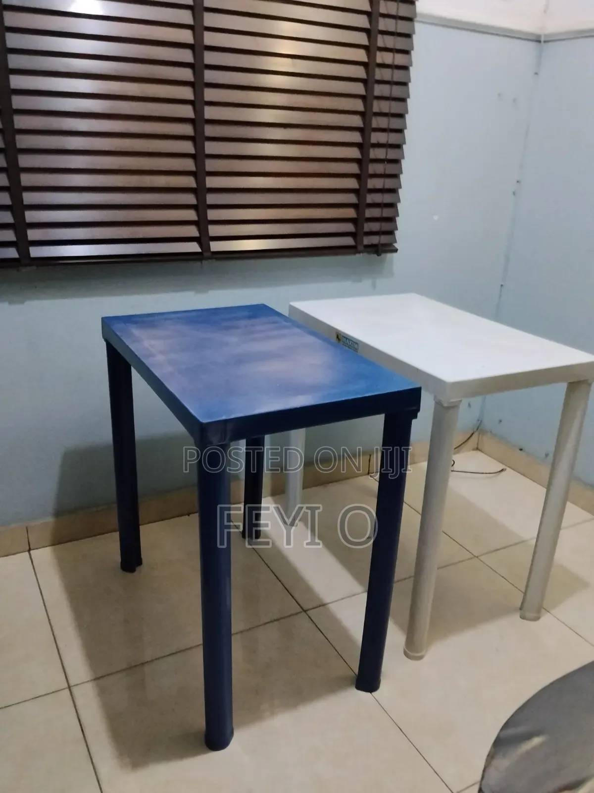 2 White and Blue Plastic Tables