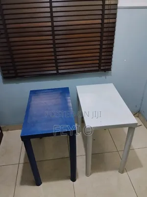 2 White and Blue Plastic Tables
