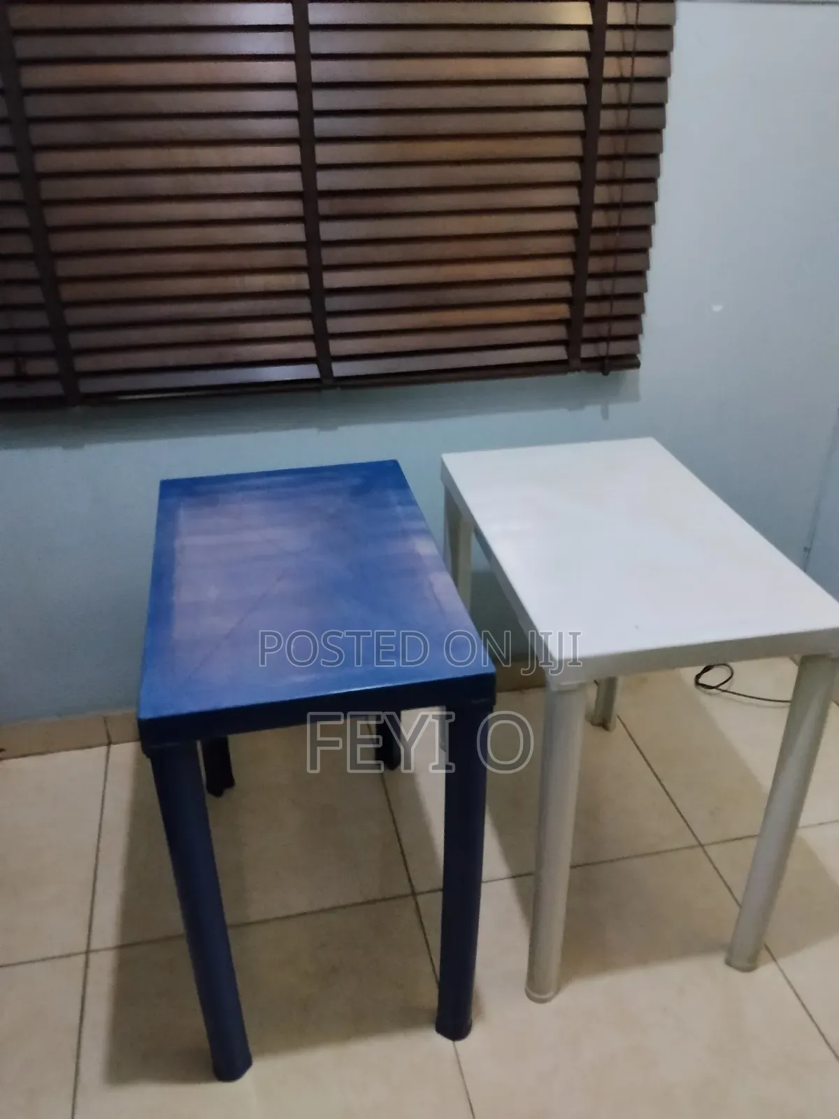 2 White and Blue Plastic Tables