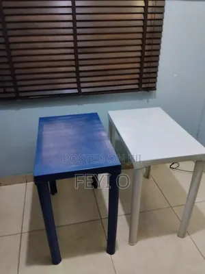 2 White and Blue Plastic Tables