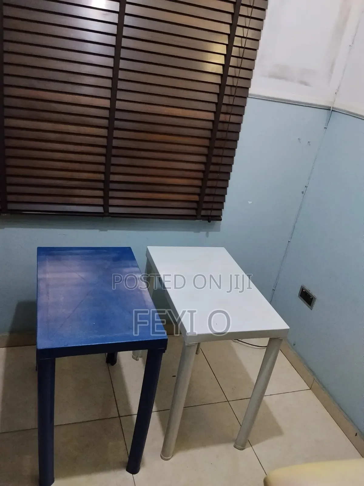 2 White and Blue Plastic Tables