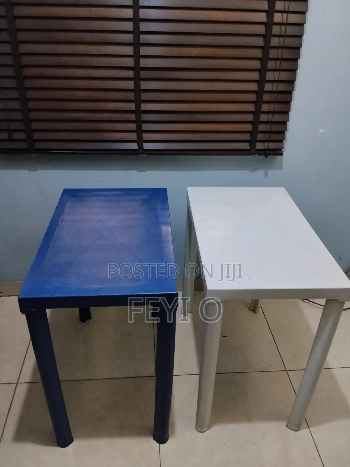 2 White and Blue Plastic Tables