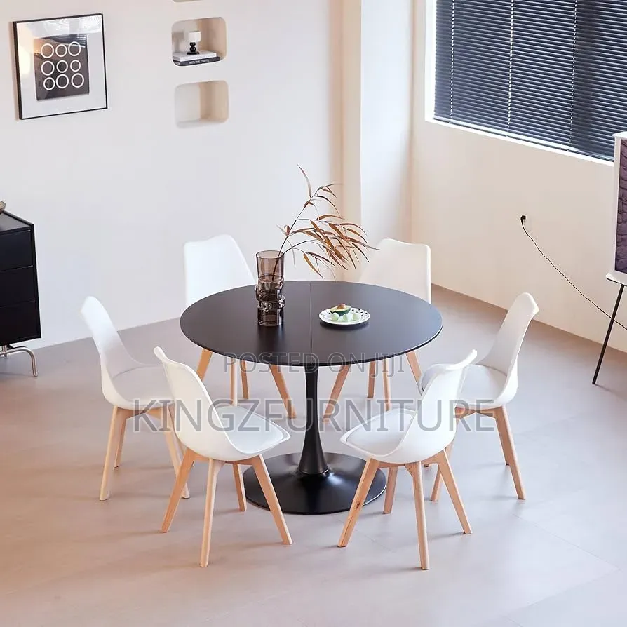 A Circle Dining Table and Four Matching Chairs.