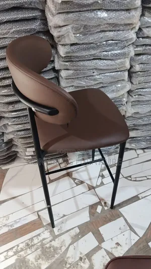 Modern Bar Stool Features a Brown Leatherette Padded Seat.