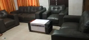 Black Leather 7 Sitter Sofa.