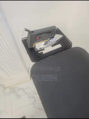 Neatly Used Ironing Board Electric Iron