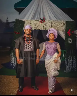 Beaded Lavender Lace Gown and Embroidered Black Agbada