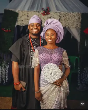 Beaded Lavender Lace Gown and Embroidered Black Agbada