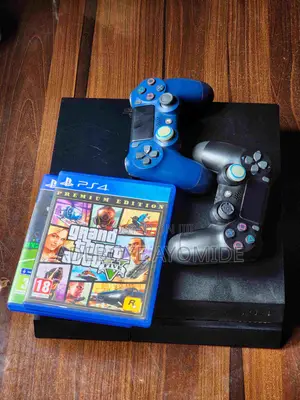 Sony PlayStation 4 PS4 Fat + FC 25 GTA 5 and 2 More Games