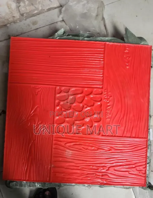 Red Concrete Stamp Mould Used to Create Textured Patterns on Pavement