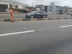 Land With Structure Near Ikeja Along