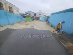 Land With Structure Near Ikeja Along